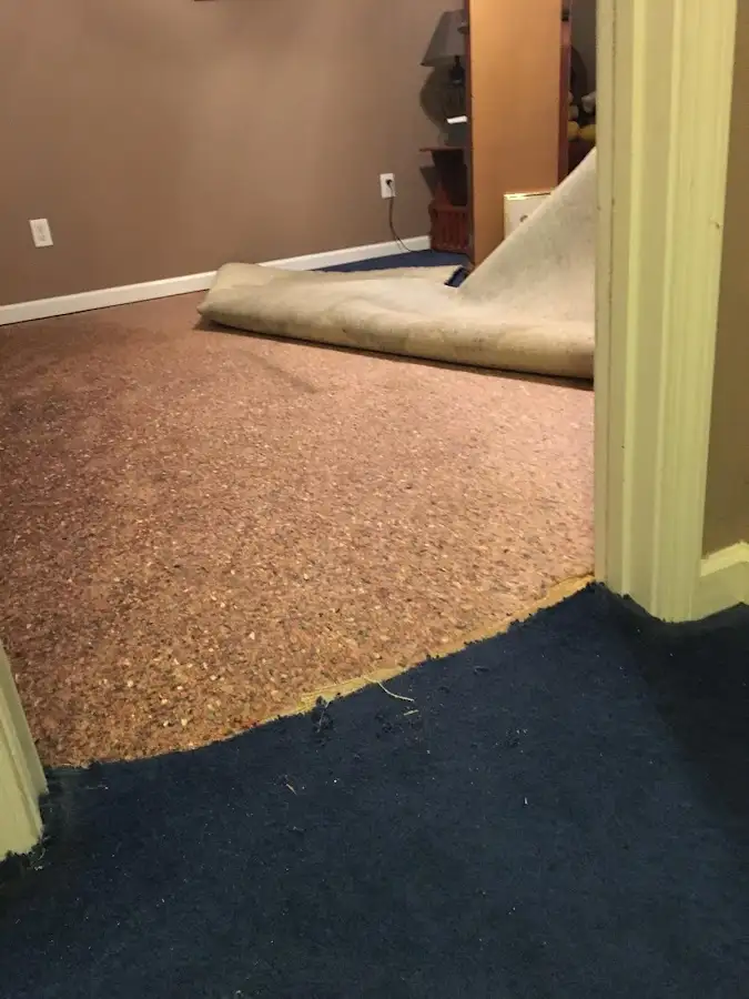 Carpet pad removal revealing water damage during Drying & Dehumidification in Port Arthur
